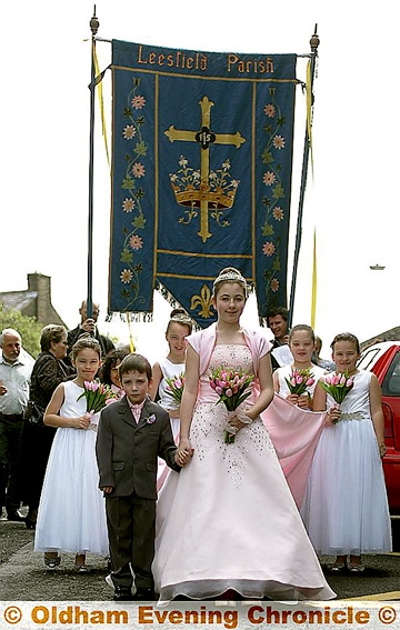 Rose Queen Melissa Taylor, from St Thomas’s in Lees, accompanied by her retinue and Lukas Briggs 
