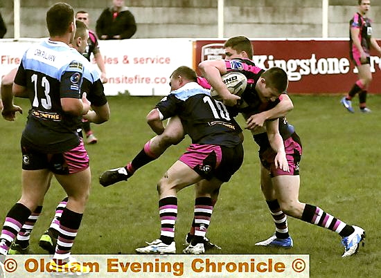 OVER THE TOP: Oldham RL forward Aaron Hall takes the tackle during the Under-20s’ 36-24 home loss to York. 
