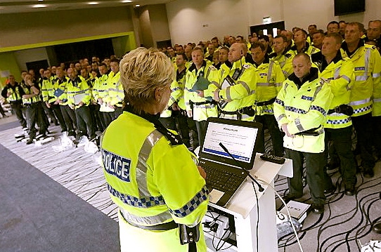 Out in force — police officers are briefed before the co-ordinated raids on scrapyards in Oldham and other part of Greater Manchester
Out in force — police officers are briefed before the co-ordinated raids on scrapyards in Oldham and other part of Greater Manchester