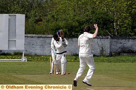 END OF THE LINE . . . Oldham top scorer Zoaib Shah is bowled by Crompton’s Danny Taylor. END OF THE LINE . . . Oldham top scorer Zoaib Shah is bowled by Crompton’s Danny Taylor.