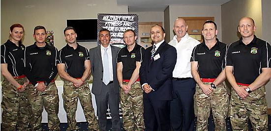 A fine company . . . from left, instructors Becki Turner, Wayne Barker, Jason Magee, financial director Bill Moore, Mike Hamilton, David Fugurally from the Department for Education, Terry Flanagan, instructors Dave Aston and Steve Hodson 
