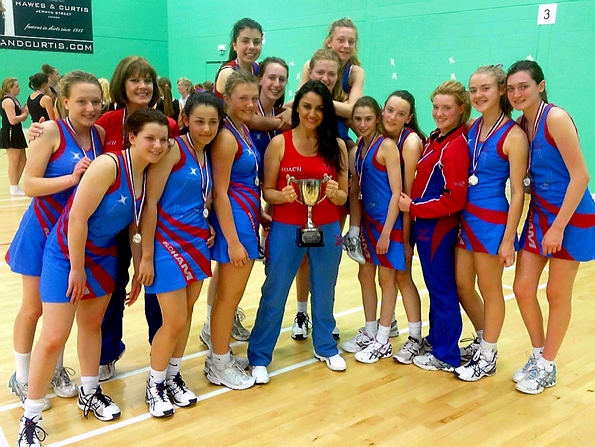 CUP OF CHEER . . . Oldham under-14s and coach Pam Hazelton are all smiles after clinching the national title.