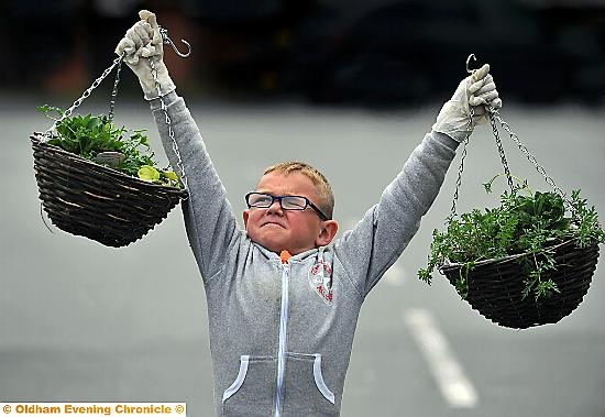 Luke Mahoney was one of many green-fingered volunteers grafting to spruce up hundreds of homes  

