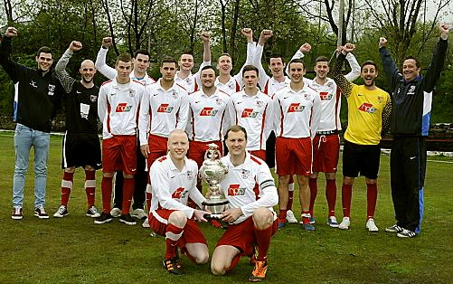 UPPERMILL captain Andrew Phelby (front, right) and Bobby Greenwood show off the Huddersfield and District League Division One trophy. 