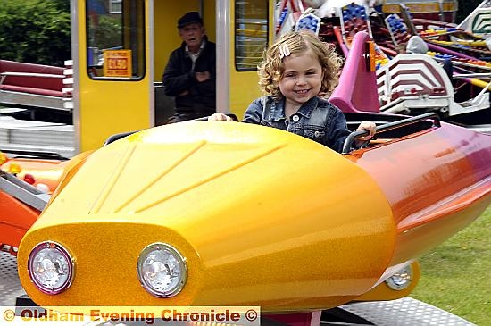 ALL the fun of the fair . . . Ava Wait enjoys the rockets. 
