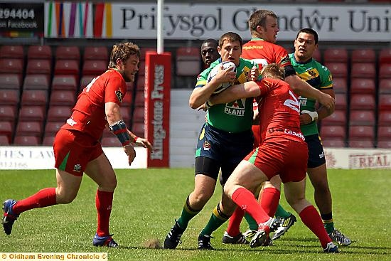 PHIL Joy attempts to break through a Crusaders tackle. 