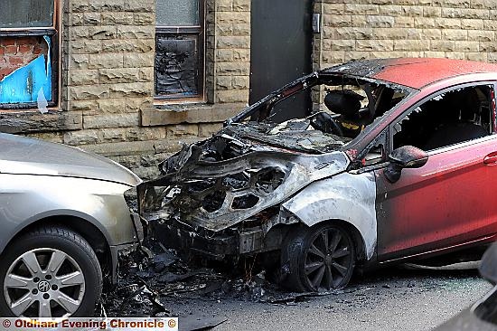ONE of the cars destroyed in the attacks
ONE of the cars destroyed in the attacks