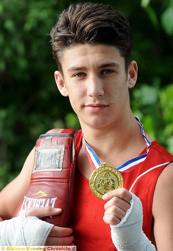 BOXING CLEVER . . . Danny Wright shows off his medal for winning both of his bouts on his England debut. BOXING CLEVER . . . Danny Wright shows off his medal for winning both of his bouts on his England debut.