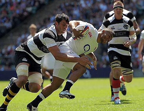 INTERNATIONAL CLASS . . . Kyle Eastmond scores a try during an England friendly against the Barbarians at Twickenham in May. 