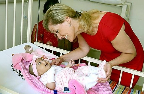 The Countess coos over little Sana Yasar on the children’s ward. Pictures by DARREN ROBINSON, ANTHONY MILLER, LUCY WORDSWORTH and PENNINE ACUTE TRUST 
