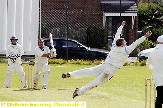 WHAT A CATCH . . . Heyside batsman Tony Heaton can hardly believe it as he is caught and bowled by Greenfeld’s Alex Peters. 