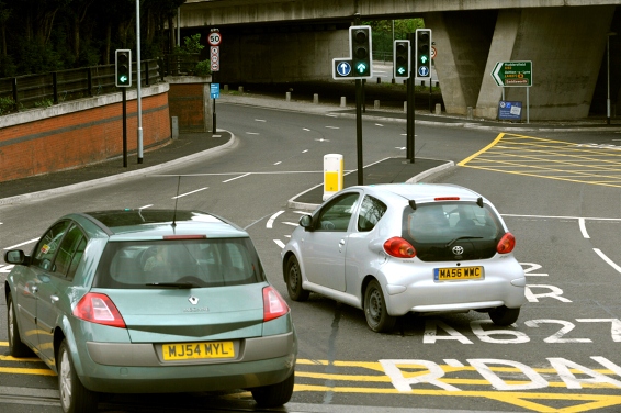 CLOSE call . . . these two cars almost collide as they attempt to join the lanes to approach the bypass CLOSE call . . . these two cars almost collide as they attempt to join the lanes to approach the bypass