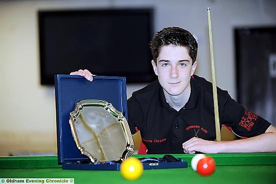 Aaron Davies with his junior billiards title trophy. 