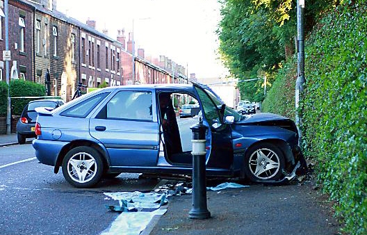 HORROR smash: Mr Howarth’s car crashed into a cemetery wall Picture: Danny Sheppard 