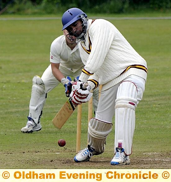 GLODWICK’S Imran Asghar digs out a delivery. GLODWICK’S Imran Asghar digs out a delivery.