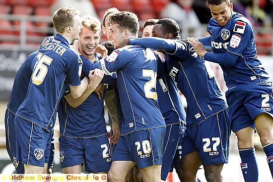 FIRST GOAL: Kirk Millar (second left) celebrates with team-mates after netting at Leyton Orient. 