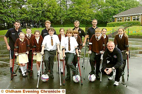 ON the ball: coach Pete Wild (front, right) visits St Joseph’s School with some of his team
ON the ball: coach Pete Wild (front, right) visits St Joseph’s School with some of his team