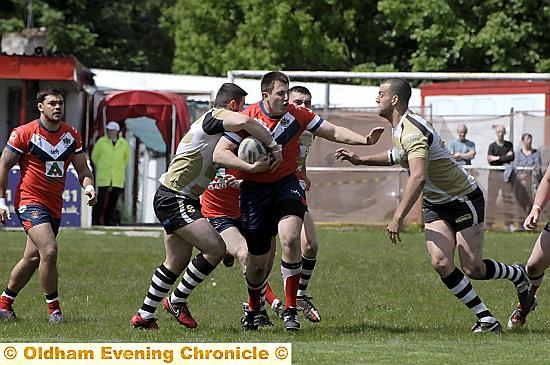DRIVING FORWARD: Oldham’s Phil Joy takes up possession. 