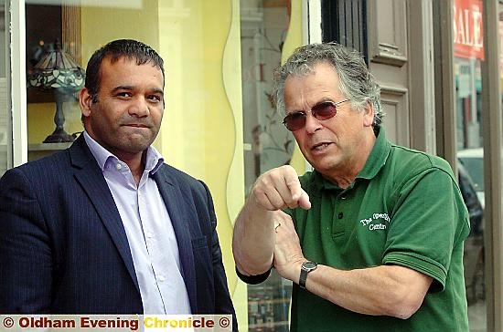 Deputy council leader Shoab Akhtar met store owner Alan Hopkinson last July to discuss the Metrolink traffic issues 
