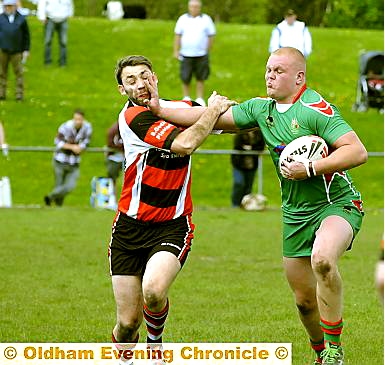 DETERMINATION: Waterhead man David Orwell takes possession in the enthralling contest at Peach Road.  

