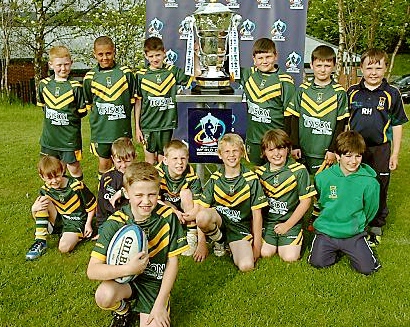 UNDER NINES captain Sam Ratcliffe with his team and the cup 