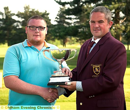 WELL DONE, CLUBMATE: Adam Rowbotham receives the District Championship trophy from Werneth captain James Buckley (right).
WELL DONE, CLUBMATE: Adam Rowbotham receives the District Championship trophy from Werneth captain James Buckley (right).