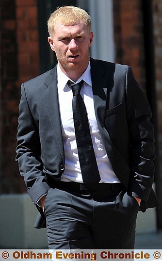 PAUL SCHOLES arrives for the service 