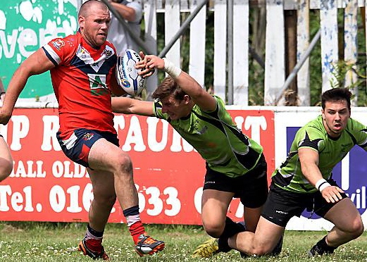 up and running: two-try centre Josh Crowley leaves two South Wales Scorpions players in his wake. 