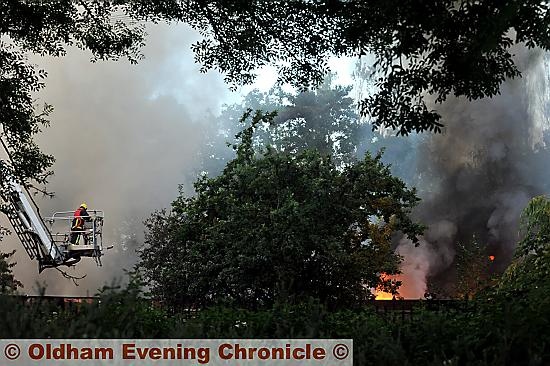 DOUSING the flames: firefighters used hydraulic platforms to get to the blaze. DOUSING the flames: firefighters used hydraulic platforms to get to the blaze.