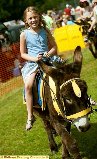 Show FUN: Seven-year-old Mia Wright enjoys her donkey ride 

