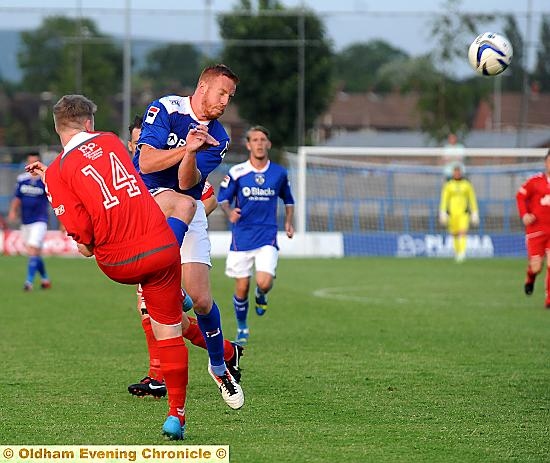 COLLISION COURSE . . . Adam Rooney charges down a Curzon Ashton clearance at the Tameside Stadium last night. COLLISION COURSE . . . Adam Rooney charges down a Curzon Ashton clearance at the Tameside Stadium last night.
