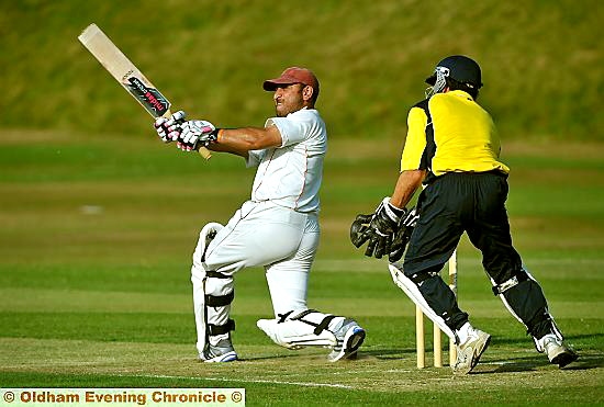 TAKE THAT . . . Delph’s Faisal Butt finds the boundary. TAKE THAT . . . Delph’s Faisal Butt finds the boundary.