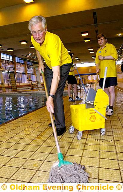 NOT afraid to get his hands dirty: Michael Meacher takes up a Unison challenge and cleans at Oldham Sports Centre.  

