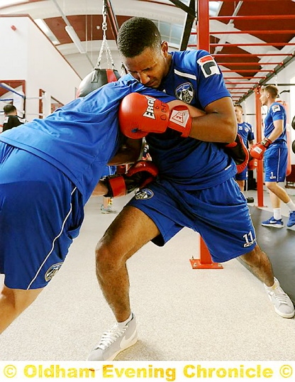 DON’T PUSH ME . . . Cristian Montano gets to grips with a team-mate. 