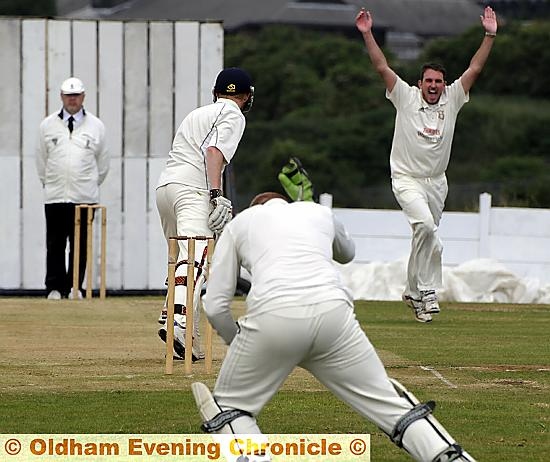 CELEBRATION time for Saddleworth bowler Ryan McGrath as he dismisses Micklehurst batsman Daniel Clayton. 
