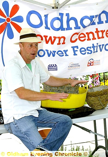 Green fingers . . . TV gardener Joe Swift talks to shoppers about his plants 