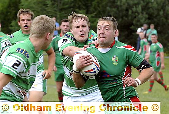Waterhead’s Kieran Grennan attempts to make a break.
Waterhead’s Kieran Grennan attempts to make a break.