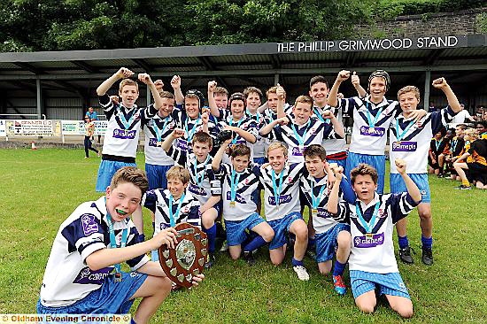 BEAT THAT! . . . Saddleworth School’s Year Sevens team enjoy their victory celebrations. 