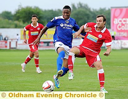 MIDFIELD BATTLE . . . Sidney Schmeltz (above) attempts to win possession. 