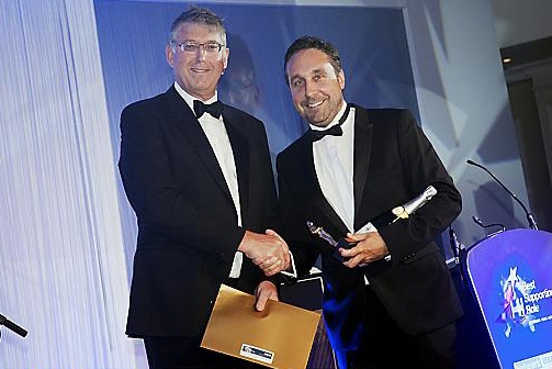 John Ogilvie presenting trophy to Michael Griffiths. 