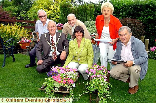 Parish council chairman Councillor Graham Sheldon and other judges in the garden of Thomas Adamson, who won third prize for the Medium Garden Category Parish council chairman Councillor Graham Sheldon and other judges in the garden of Thomas Adamson, who won third prize for the Medium Garden Category