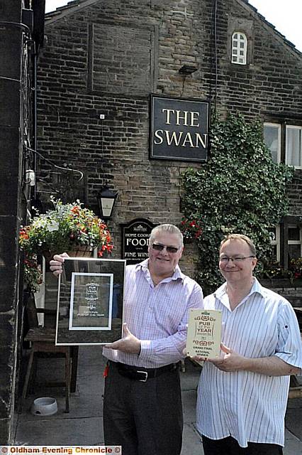 Pub awards. The Swan in Dobcross. Landlords Tim Newbold and Michael Powis Pub awards. The Swan in Dobcross. Landlords Tim Newbold and Michael Powis