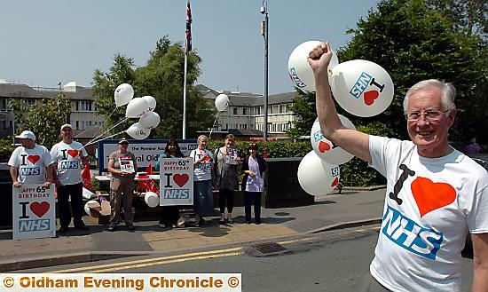 MANY happy returns . . . Michael Meacher helps the NHS to celebrate its 65th birthday at the Royal Oldham Hospital on Friday 

