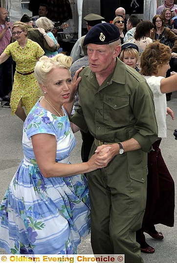 Couples do the jitterbug outside the Wagon and Horses in Uppermill. 