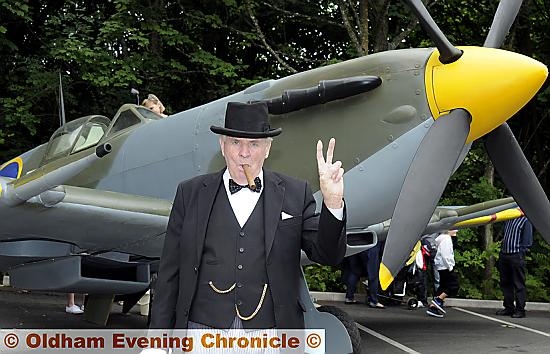 A Sir Winston Churchill lookalike with a Spitfire at Saddleworth School  

