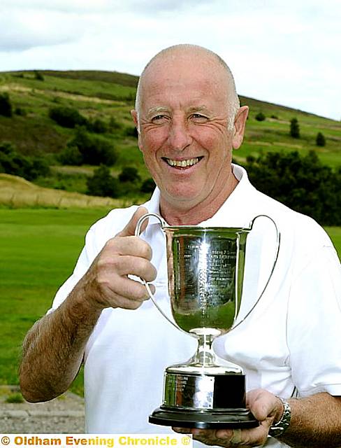 JUST CHAMPION . . . Richard Hughes shows off his trophy JUST CHAMPION . . . Richard Hughes shows off his trophy