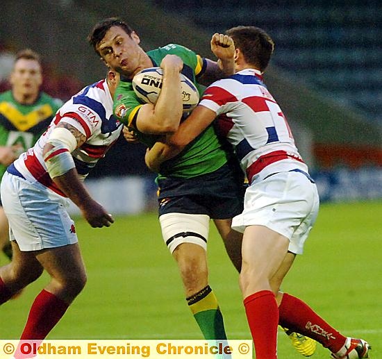 OLDHAM skipper Lewis Palfrey tries to burst his way through 