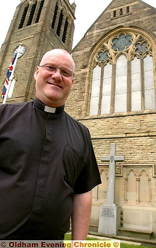 CHURCH repairs: Father David Hawthorn outside St Margaret’s Church 
