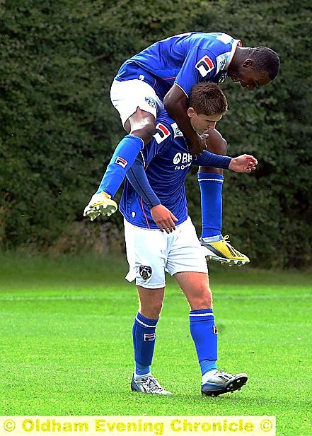 TREBLE TOP . . . Danny Philliskirk celebrates the first of his three goals for the reserves with Glenn Belezika. 
