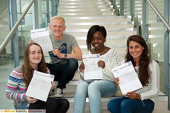 FLYING high . . . pupils at Newman College are pleased with their results 
